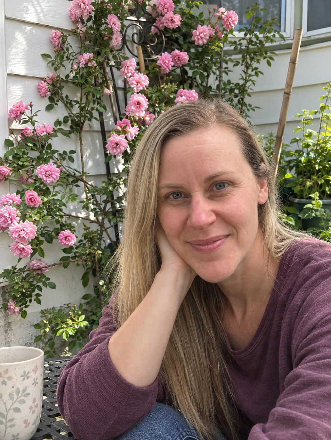 Rebecca Demers sitting in her garden